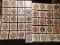 (40) Nebraska Wooden Nickels in a pair of plastic pages.