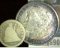 1877 S U.S. Seated Liberty Quarter & 1884 O High grade Morgan Silver Dollar with lovely toning.
