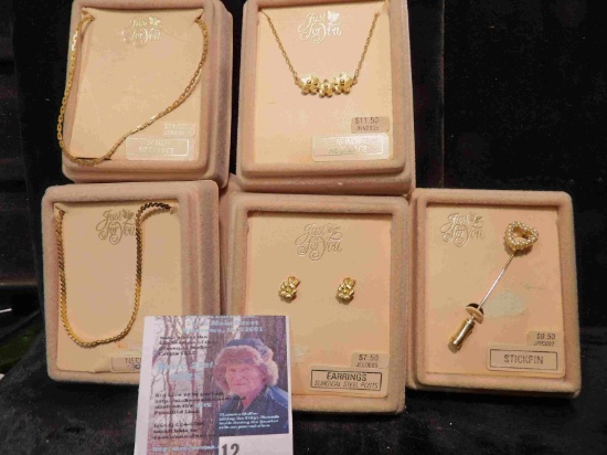 Collection of 5 different necklaces, Earrings, and pins in original Boxes. Retail value was over $30