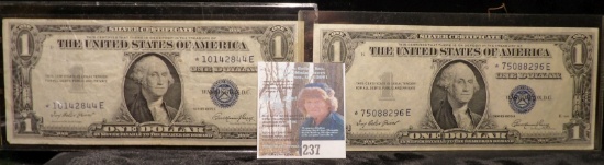 (2) Nice grade Series 1935 E Star Replacement $1 Silver Certificates in plastIc sleeves.