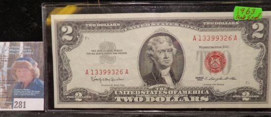 High grade Series 1963 $2 "Red Seal" U.S. Note in plastic sleeve.