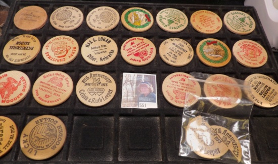 (23) Wooden Dollars, one of which is broke in half.