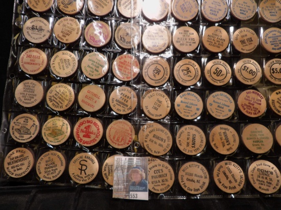 (40) Nebraska Wooden Nickels in a pair of plastic pages.