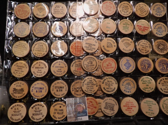 (40) Nebraska Wooden Nickels in a pair of plastic pages.