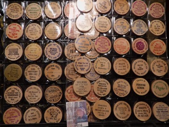 (40) Nebraska Wooden Nickels in a pair of plastic pages.