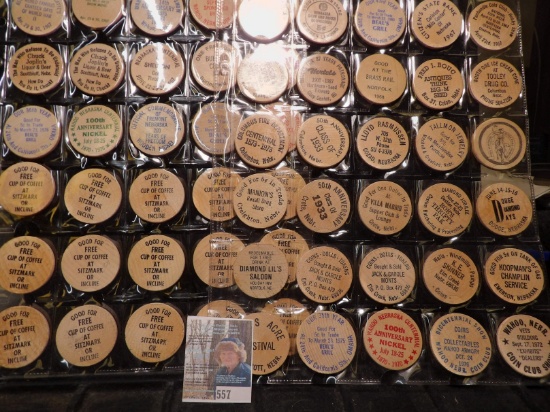 (40) Nebraska Wooden Nickels in a pair of plastic pages.