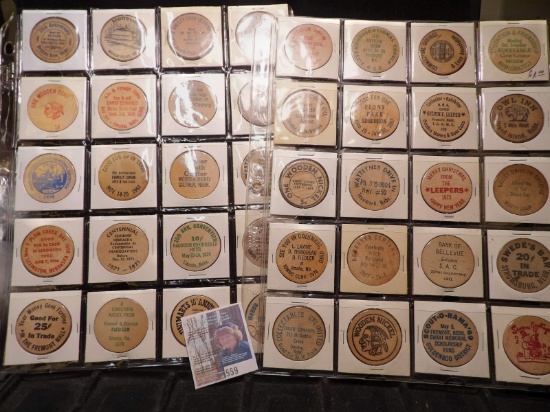 (40) Nebraska Wooden Nickels in a pair of plastic pages.