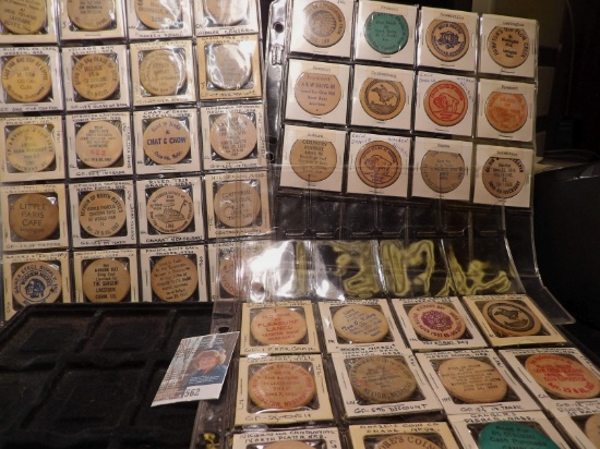 (44) Nebraska Wooden Nickels in three plastic pages.
