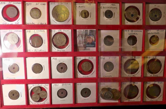 (38) various foreign coins including some Silver along with a red 28-pocket coin tray.