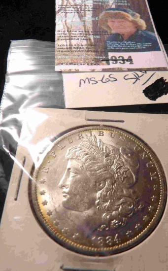 1884 O U.S. Morgan Silver Dollar, carded. Brilliant Uncirculated.