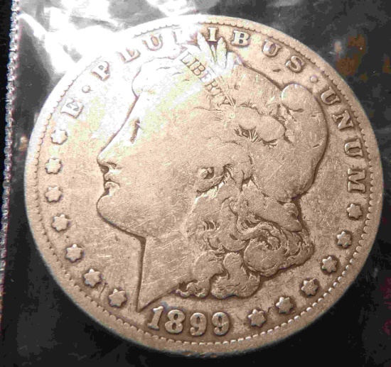 1899 O U.S. Morgan Silver Dollar, carded.