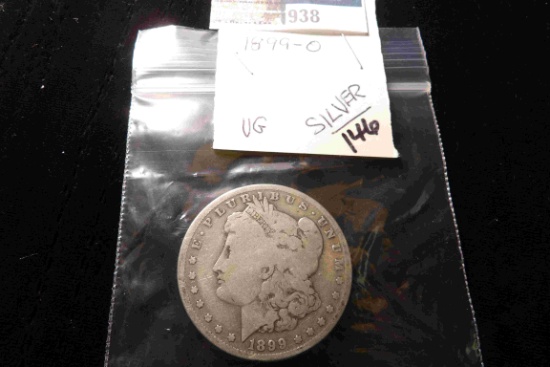 1899 O U.S. Morgan Silver Dollar, VG, carded.