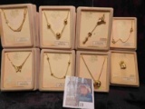 Collection of 8 different necklaces and pins in original Boxes. Retail value was over $50.00.