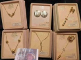Collection of 6 different necklaces, Earrings, and pins in original Boxes. Retail value was over $30