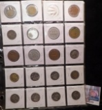 20-pocket plastic page full of mostly foreign coins.