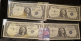 (4) High grade Series 1957B $1 Silver Certificates in plastIc sleeves.
