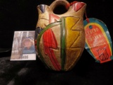 Clay Indian Wedding Pitcher with hang tag explaining it's significance.