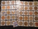 (40) Nebraska Wooden Nickels in a pair of plastic pages.