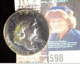 1962 P Toned Silver Proof Franklin Half Dollar.