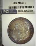1885 O Morgan Silver Dollar slabbbed PCI MS65+. Attractive obverse toning.