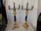 2 piece vintage cast metal painted gold and black figural tri-footed candlestick holders, with winge