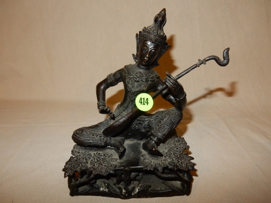 Unique cast metal / bronze? Asian temple figure, depicting man playing guitar seated on leaf and twi