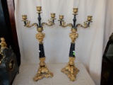 2 piece vintage cast metal painted gold and black figural tri-footed candlestick holders, with winge