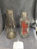 Two piece vintage milk bottles