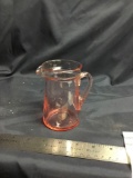 Vintage pink depression pitcher with applied handle