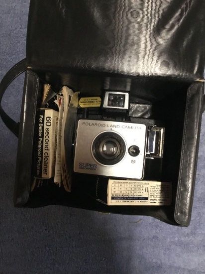 Vintage Polaroid camera in case