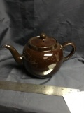 Brown teapot made in England measures 9 inch from spout to handle