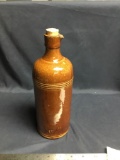 Antique rare pottery bottle with cork marked on side by maker