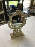 very ornate cast iron tilt mirror heart shaped