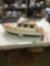 large remote controlled cabin boat with brass propeller shaft and chrome rotors needs repair in