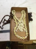 box of Hawaiian shell necklaces