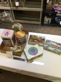 box of seven piece collector tins