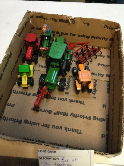 box of toy tractors