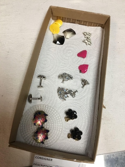 box of several sets of clip earrings