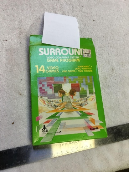 vintage Atari video games, surround with instructions in box