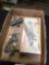 box of vintage metal, toy airplanes and metal trophy toppers
