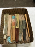 box of hand fans, some are damaged