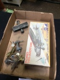 box of vintage metal, toy airplanes and metal trophy toppers