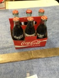 vintage six piece, Coca-Cola glass bottles with carrying case, miscellaneous advertisements