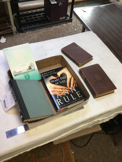 vintage box of old books with various titles