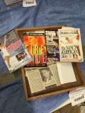wooden tray of Nancy Kerrigan books with newspaper article