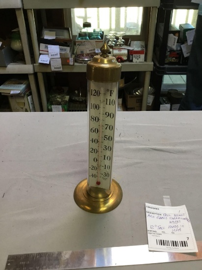 tall, brass, and glass thermometer works made in USA
