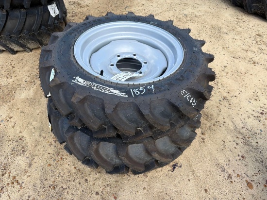 UNUSED (2) 7-16 TIRES ON 6 LUG RIM