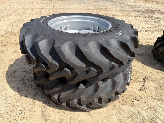 UNUSED (2) 16.9-28 TIRES ON 8 LUG RIM
