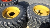 (4) New 12-16.5 CAT Tires & Wheels