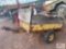 Small cart with wheels, chains, radiator and muffler